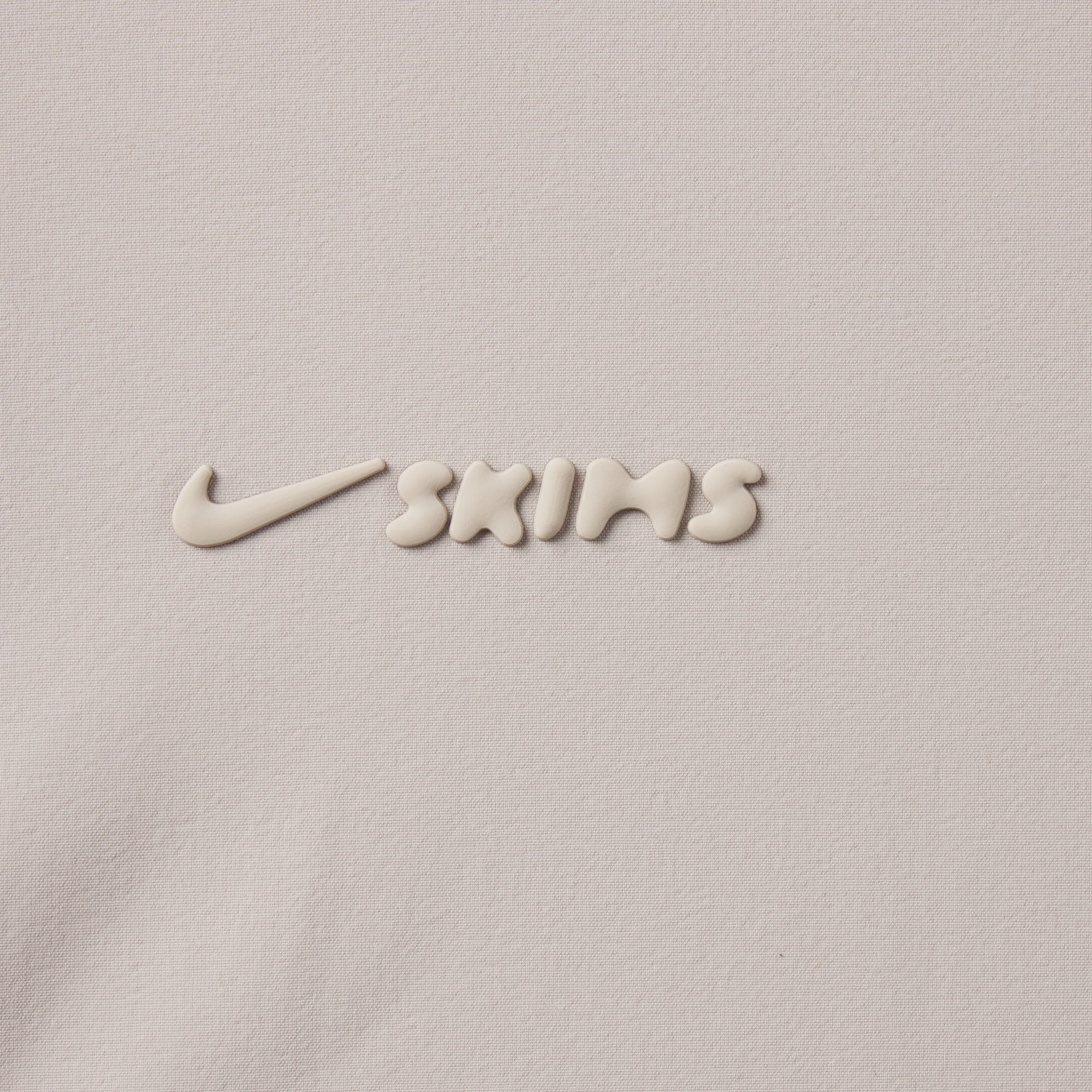 NikeSKIMS WOVEN NYLON 2.5" RUNNER SHORT | STONE